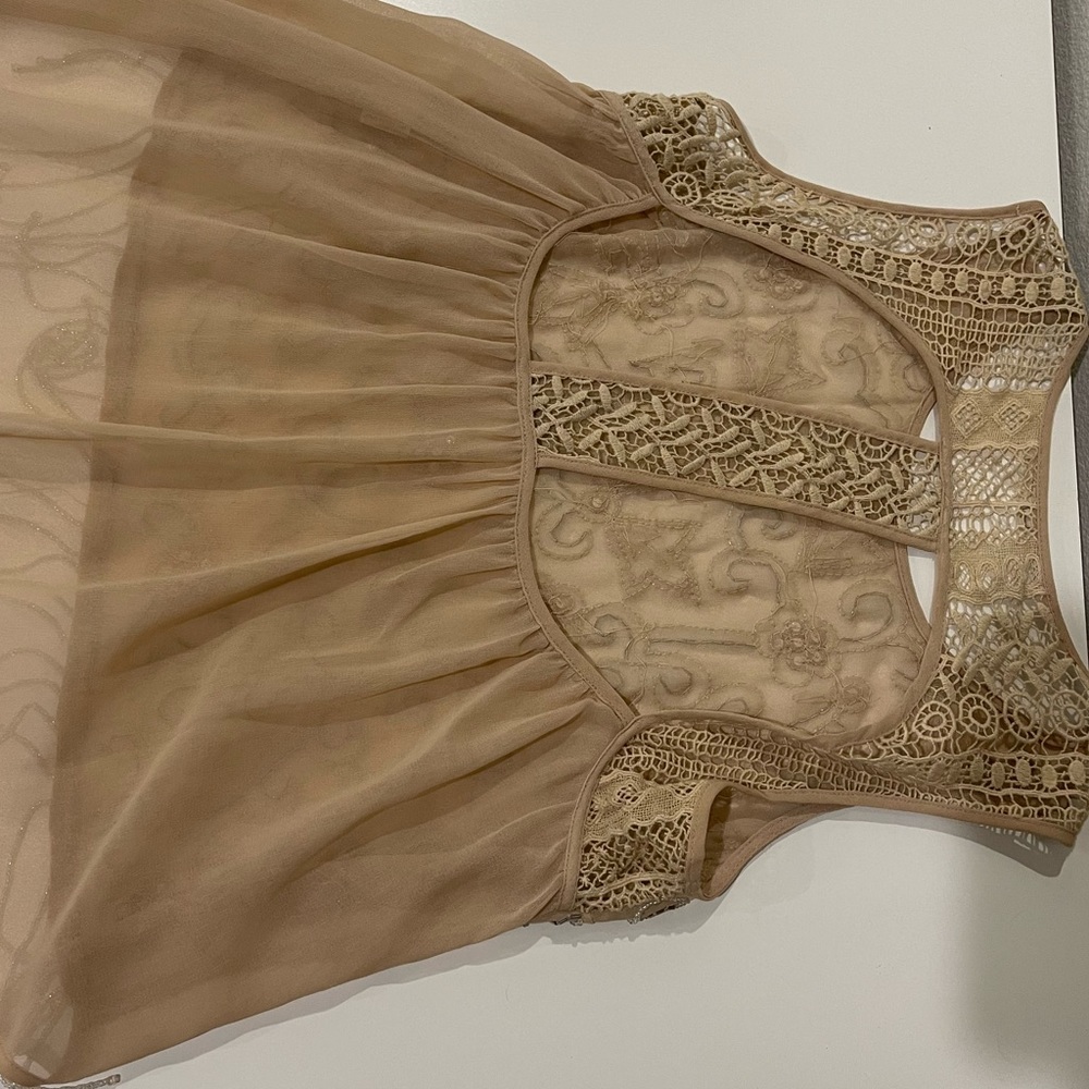 Cute shear top with lots of beading
